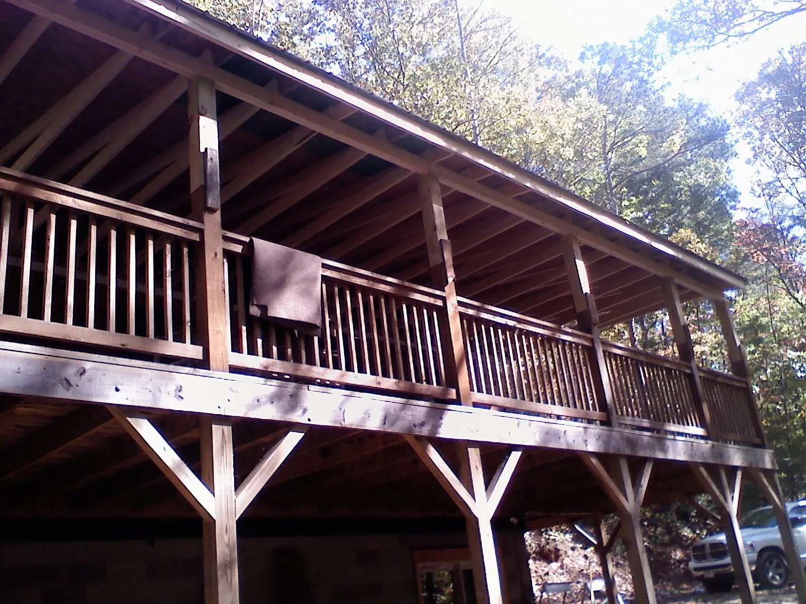Timber framing under a new elevated porch and deck — Roof Leak Repair in Bryant by Roofing Brothers